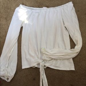 A white off the shoulder long sleeve shirt: